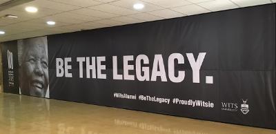 Wall in Solomon Mahlangu House concourse with Nelson Mandela memorial banner